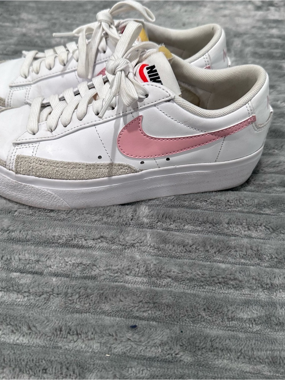 Nike Women's White Leather Sneakers with Pink Swoosh Accent